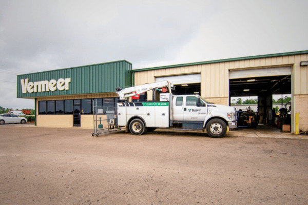 vermeer all roads service truck in front of building